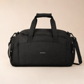 XEMORIX Signature Duffel Bag in Black with centered wordmark, structured travel design, and premium minimalist finish