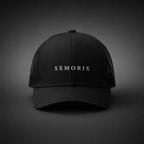 XEMORIX XMRX-015 Signature Cap in Black with centered front wordmark on a dark premium background