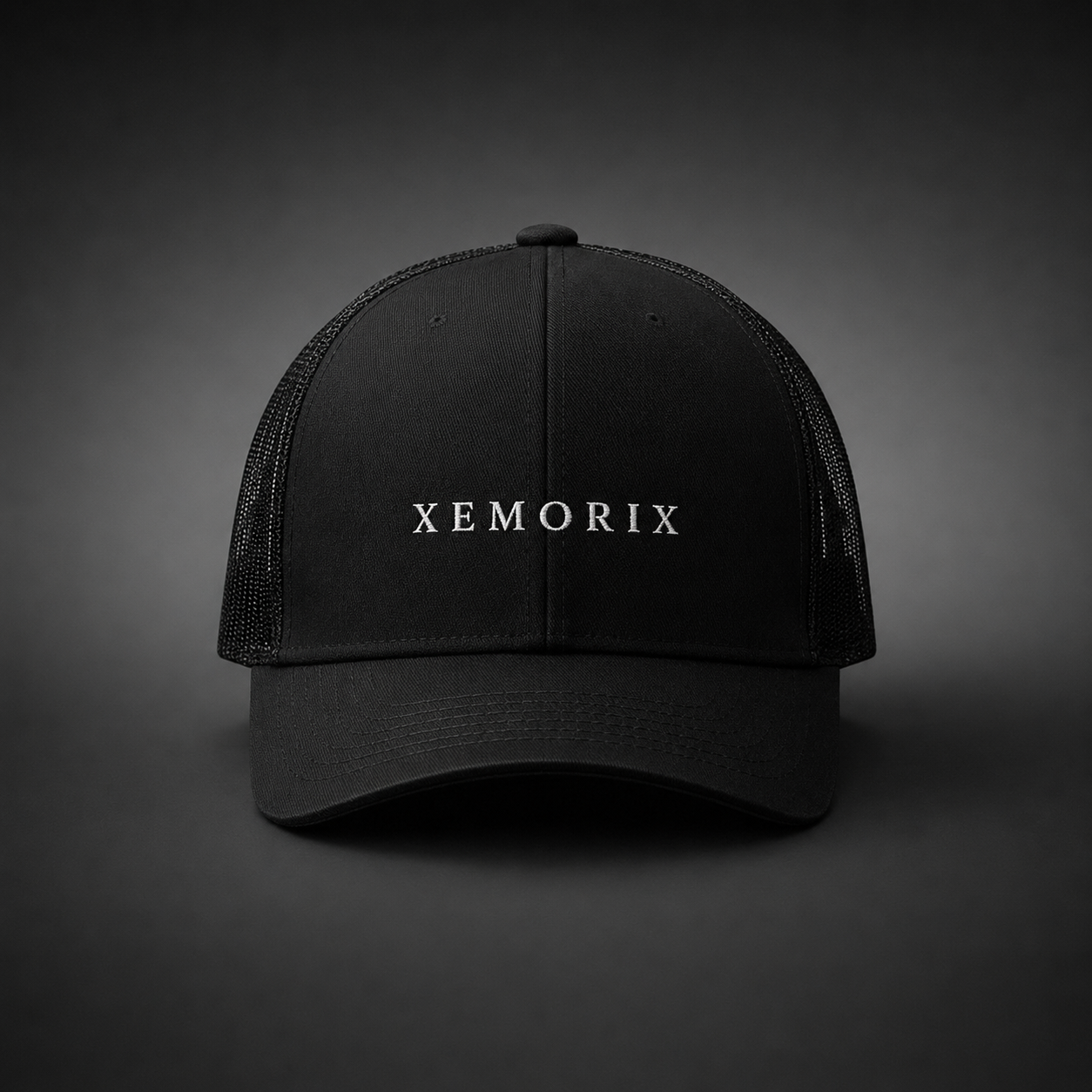 XEMORIX XMRX-015 Signature Cap in Black with centered front wordmark on a dark premium background