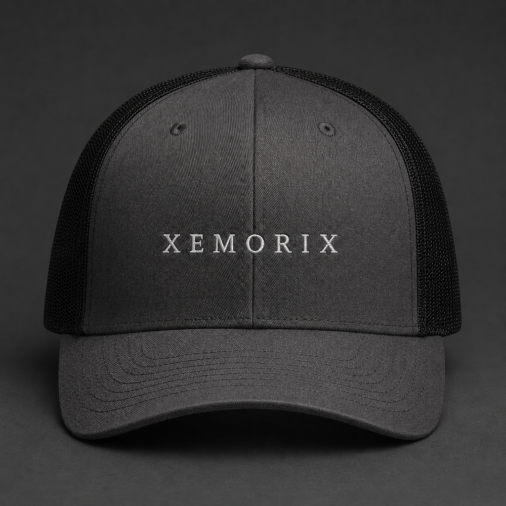 XEMORIX XMRX-022 Signature Cap in Charcoal Black with centered front wordmark on a dark premium background