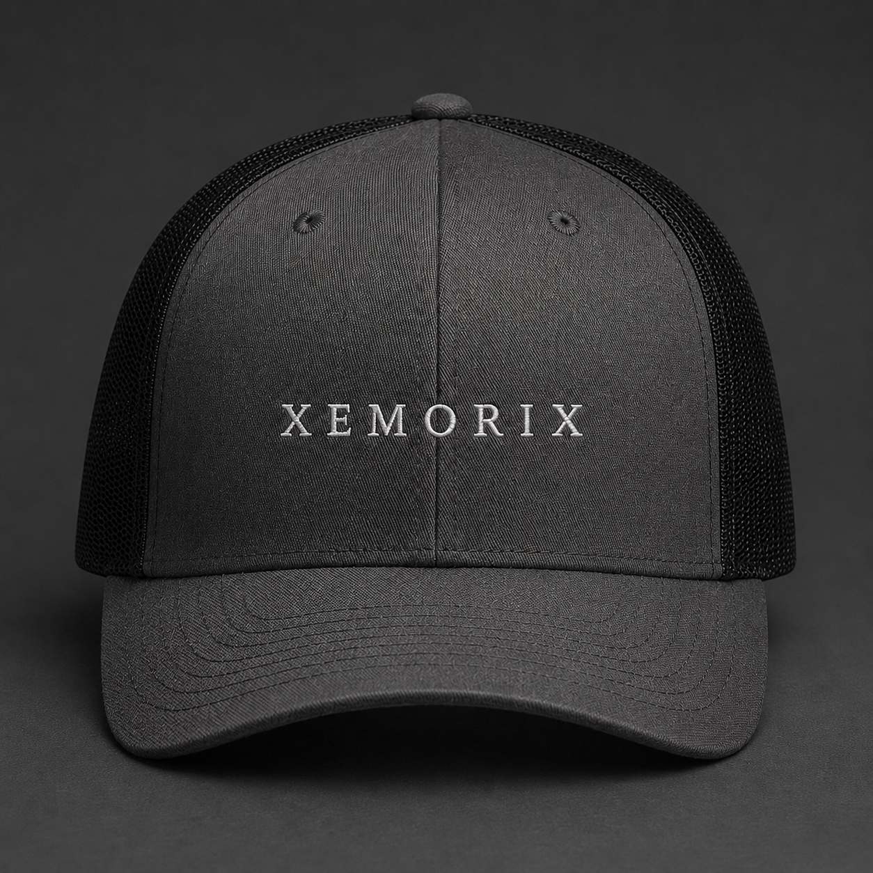 XEMORIX XMRX-022 Signature Cap in Charcoal Black with centered front wordmark on a dark premium background