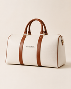 XEMORIX XMRX-024 Signature Weekender Bag in white with brown handles, centered wordmark, and premium travel duffel design