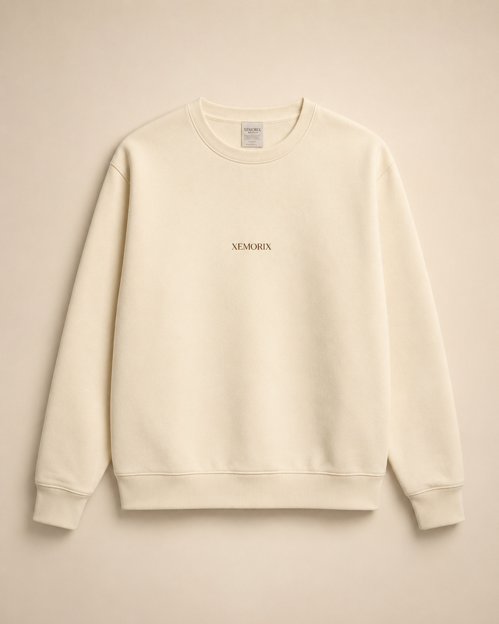 XEMORIX XMRX-042 cream essential crewneck sweatshirt with centered logo on beige luxury background