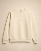 XEMORIX XMRX-042 cream essential crewneck sweatshirt with centered logo on beige luxury background