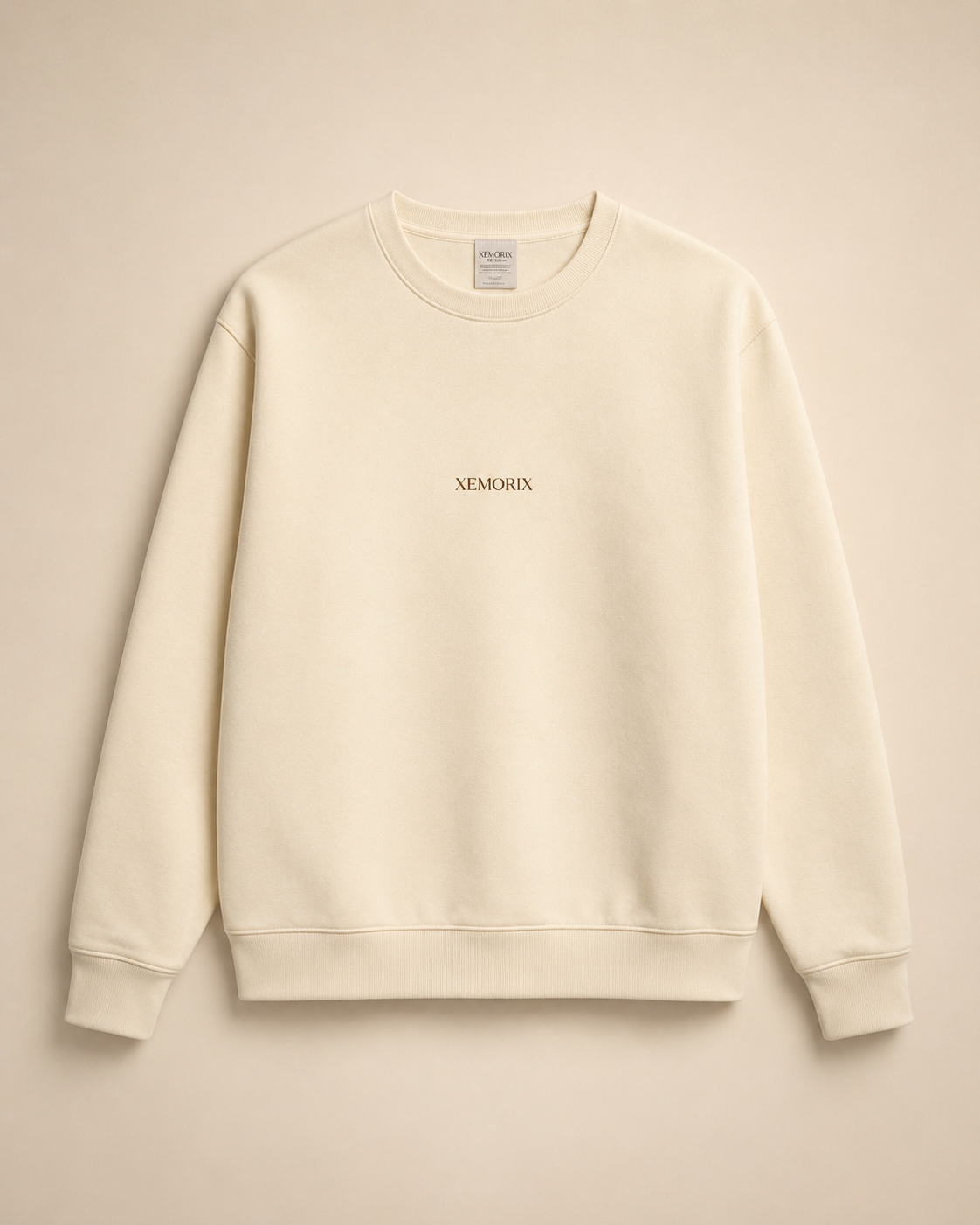 XEMORIX XMRX-042 cream essential crewneck sweatshirt with centered logo on beige luxury background